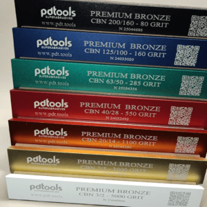 Professional 7-stone CBN sharpening set featuring PDT Premium Bronze metal bond stones in 80–5000 grit. Designed for edge repair, reprofiling, sharpening, and fine finishing with exceptional durability and long service life.